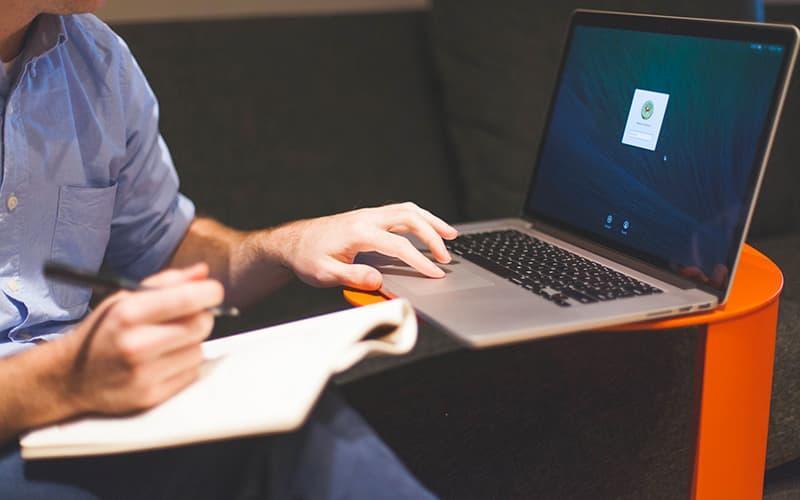 Man notebook notes macbook